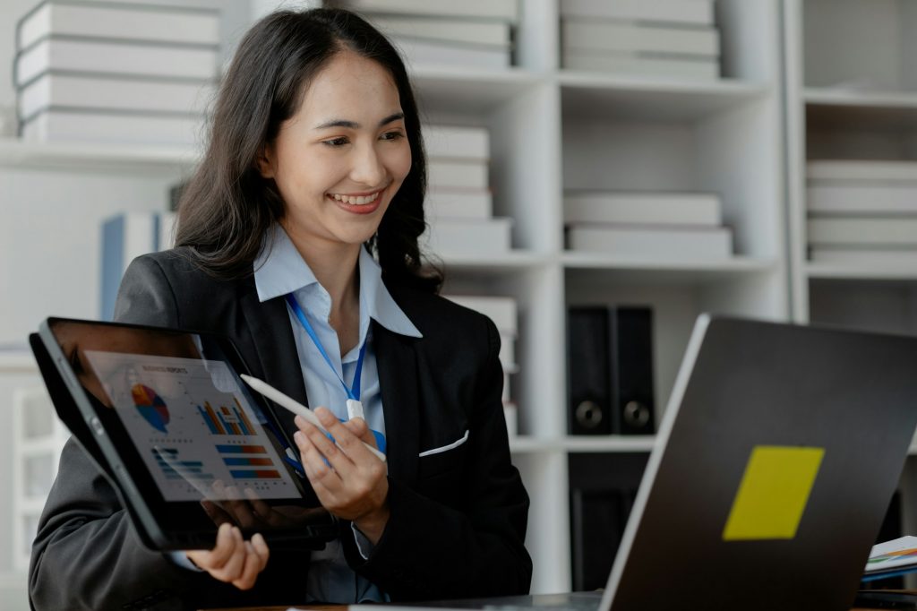 Business woman in marketing giving presentation via video call on laptop, marketer attends marketing